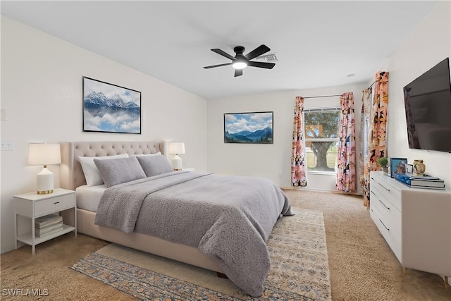 carpeted bedroom with ceiling fan