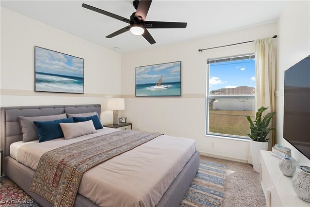 carpeted bedroom with ceiling fan