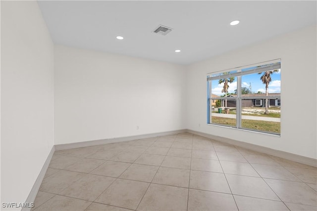 empty room featuring light tile patterned floors