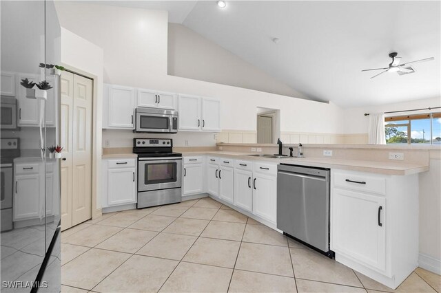 kitchen featuring sink, white cabinets, ceiling fan, kitchen peninsula, and stainless steel appliances