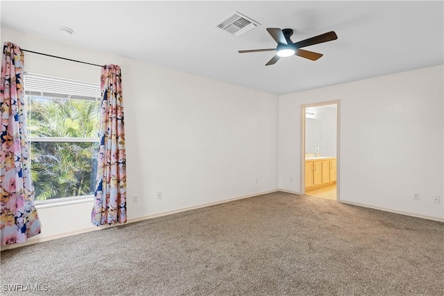 unfurnished room with light carpet and ceiling fan