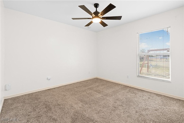 empty room with carpet and ceiling fan