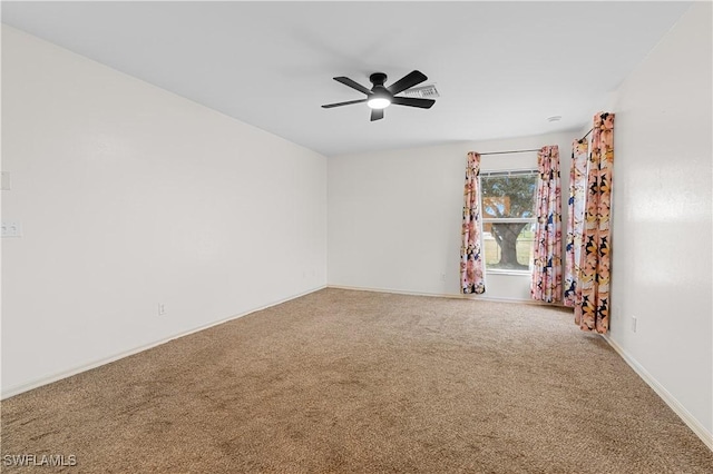 empty room with carpet and ceiling fan