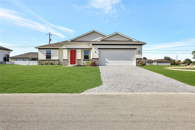 view of front of property featuring a garage and a front yard