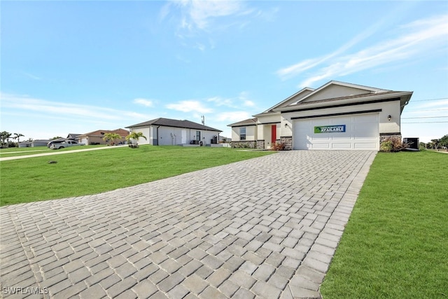 ranch-style home featuring a front lawn and a garage