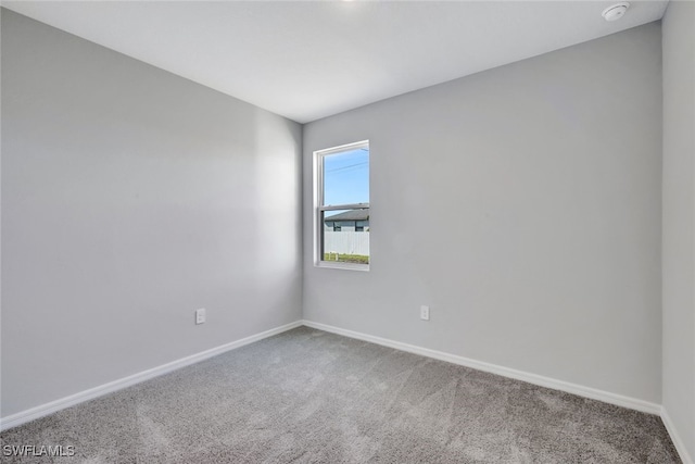 spare room featuring carpet flooring