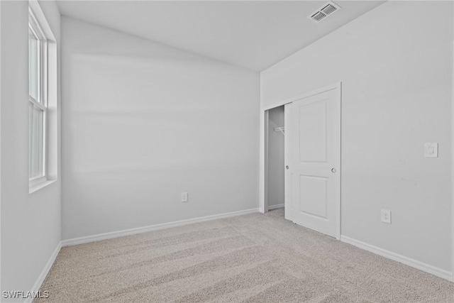 spare room with light carpet