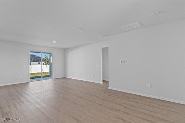 unfurnished room featuring light wood-type flooring