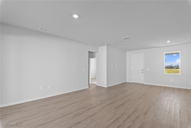 unfurnished room featuring light hardwood / wood-style flooring