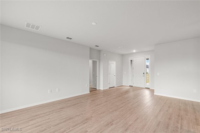 spare room featuring light hardwood / wood-style floors