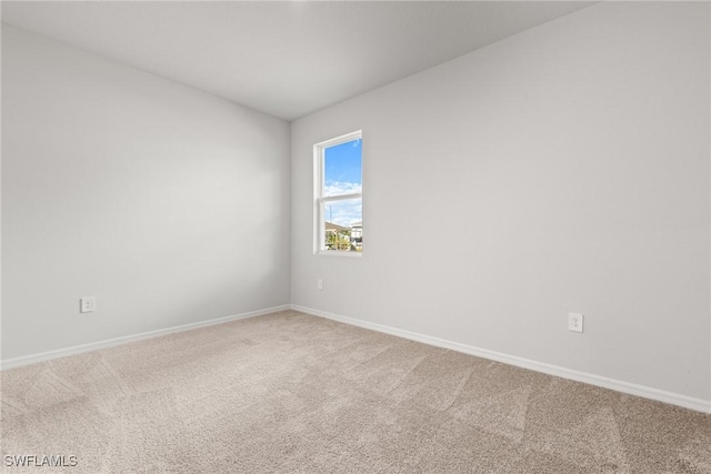 unfurnished room with carpet floors