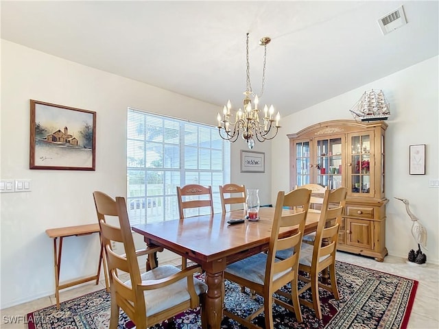 7397 Grande Pine Rd, Bokeelia, FL 33922 - dining area with a notable chandelier