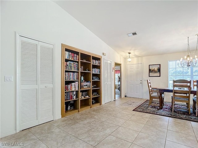 7397 Grande Pine Rd, Bokeelia, FL 33922 - tiled dining space with an inviting chandelier and lofted ceiling