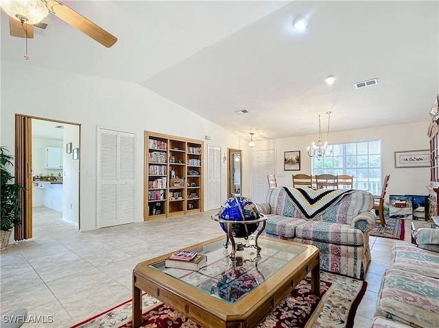 7397 Grande Pine Rd, Bokeelia, FL 33922 - tiled living room with ceiling fan with notable chandelier and lofted ceiling