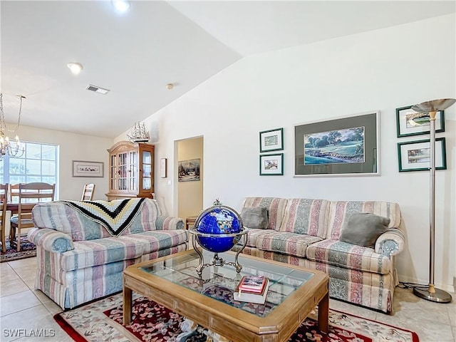 7397 Grande Pine Rd, Bokeelia, FL 33922 - living room with a chandelier, light tile patterned floors, and vaulted ceiling