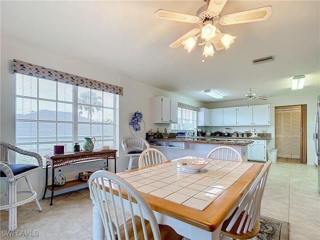 7397 Grande Pine Rd, Bokeelia, FL 33922 - tiled dining room with ceiling fan