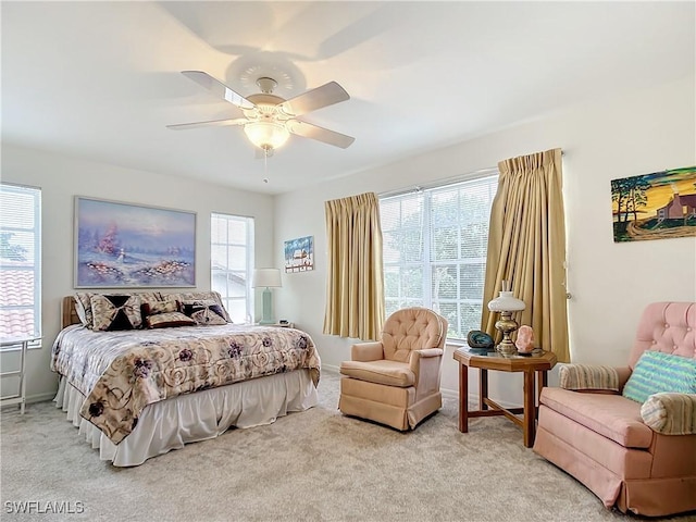 7397 Grande Pine Rd, Bokeelia, FL 33922 - bedroom featuring ceiling fan, light carpet, and multiple windows