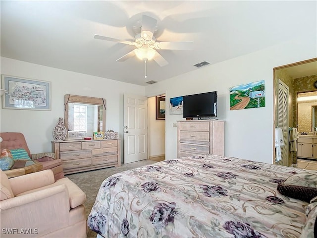 7397 Grande Pine Rd, Bokeelia, FL 33922 - bedroom with ensuite bath and ceiling fan