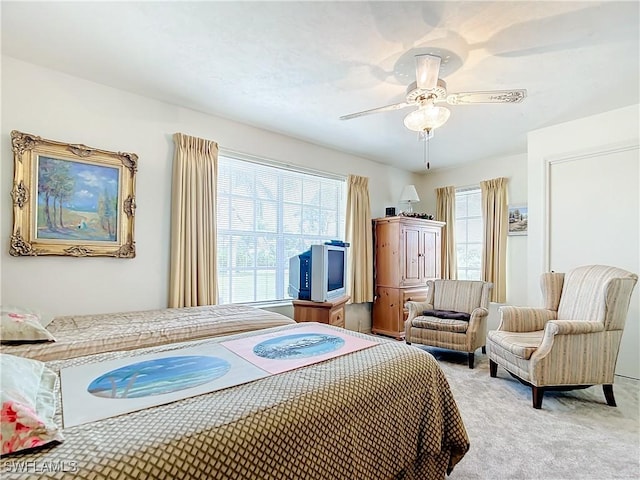 7397 Grande Pine Rd, Bokeelia, FL 33922 - bedroom featuring ceiling fan, light colored carpet, and multiple windows