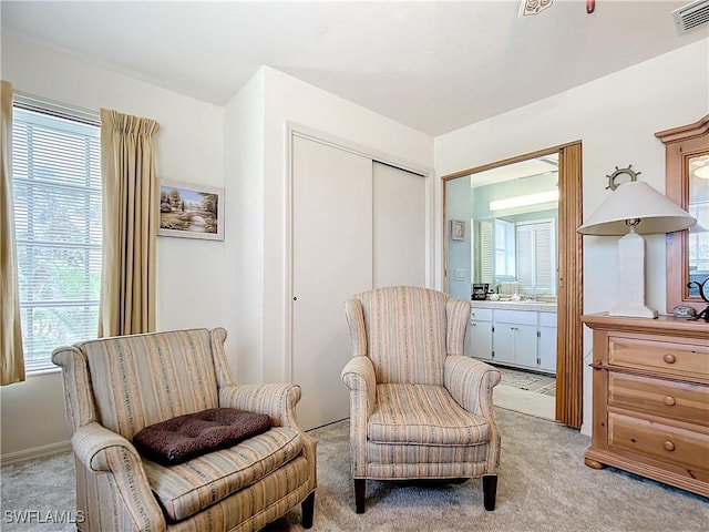 7397 Grande Pine Rd, Bokeelia, FL 33922 - sitting room with plenty of natural light and light colored carpet