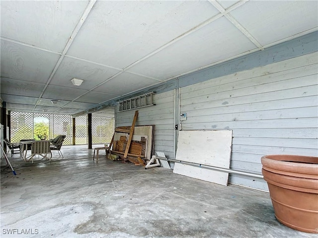 7397 Grande Pine Rd, Bokeelia, FL 33922 - garage featuring wooden walls