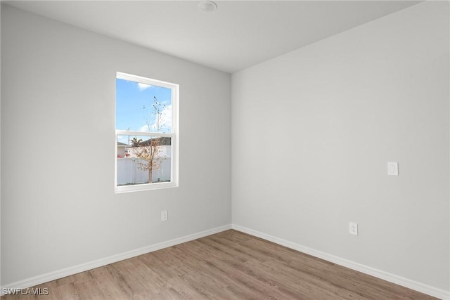 empty room with light hardwood / wood-style floors