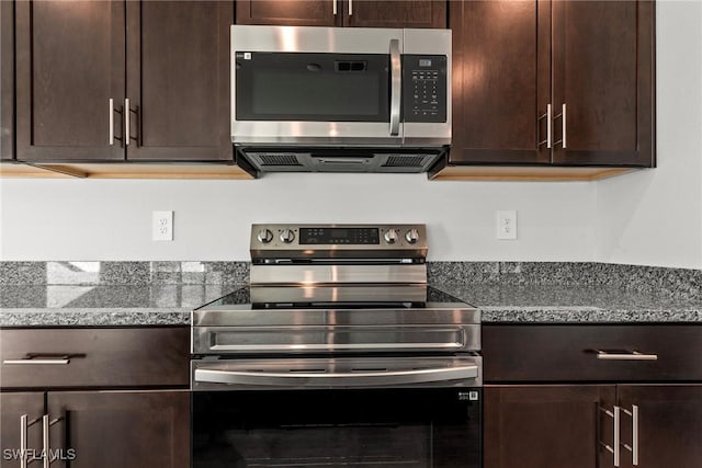 kitchen featuring dark brown cabinets, stainless steel appliances, and stone counters