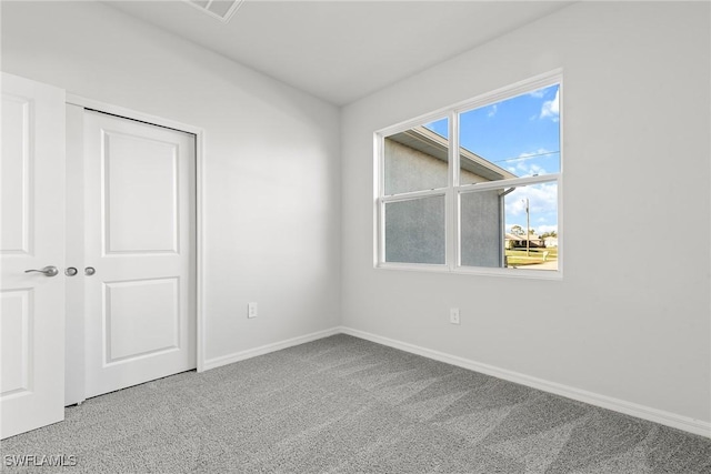 spare room featuring carpet flooring