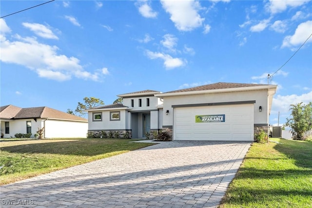 view of front of home with central AC, a garage, and a front lawn