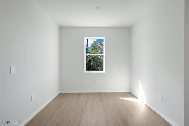 spare room with light hardwood / wood-style floors