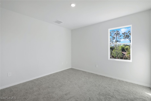 unfurnished room featuring carpet