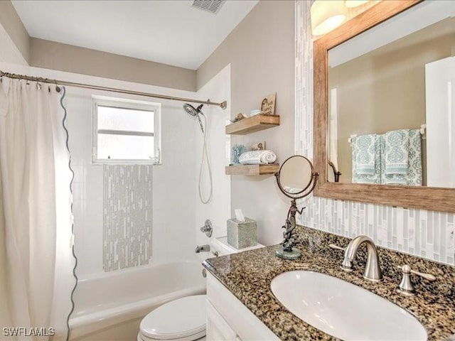 full bathroom featuring vanity, toilet, and shower / tub combo