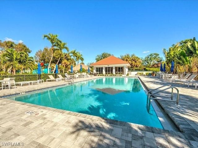 pool featuring a patio and fence