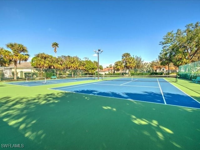 view of tennis court featuring basketball court