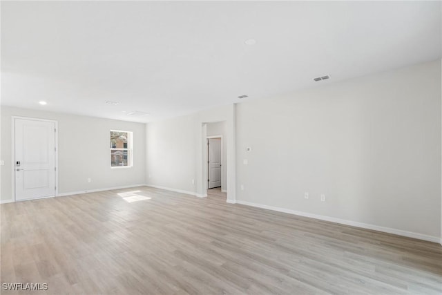 unfurnished room featuring light wood-type flooring