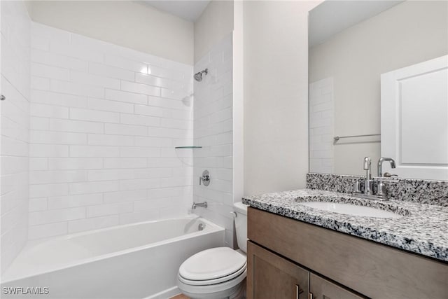 full bathroom featuring vanity, tub / shower combination, and toilet