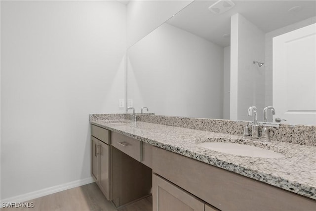 bathroom featuring hardwood / wood-style floors and vanity