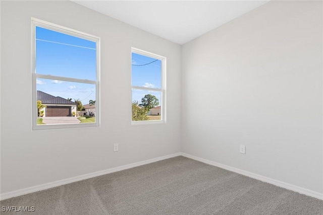 spare room featuring carpet flooring