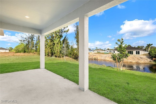 view of patio with a water view