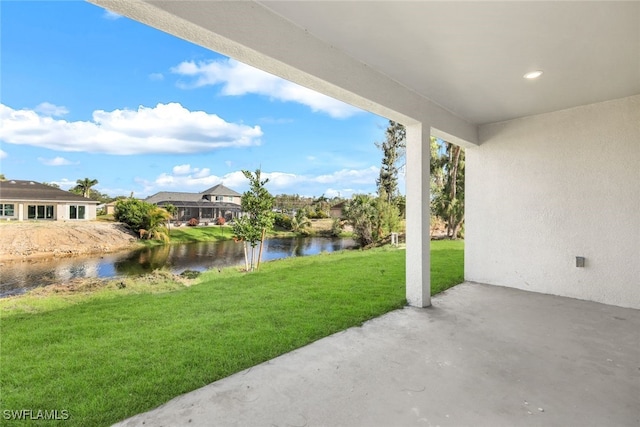 view of patio with a water view