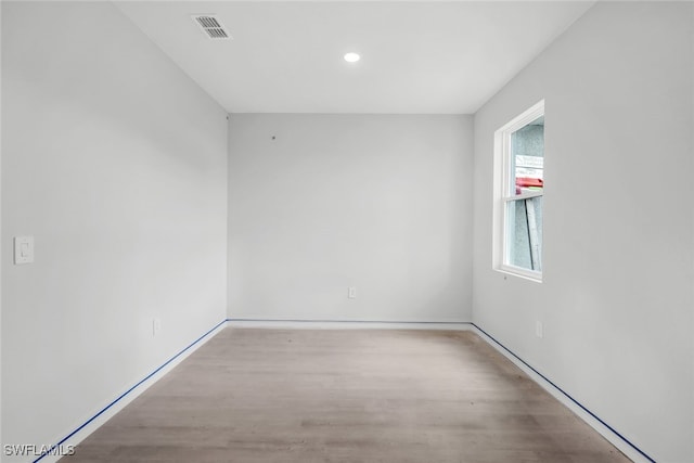 empty room with light wood-type flooring