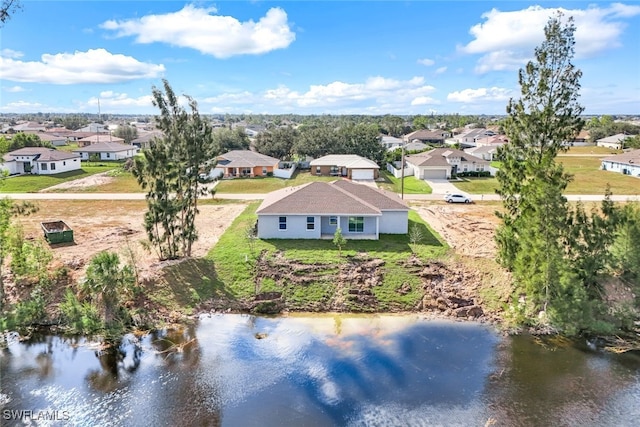 drone / aerial view with a water view