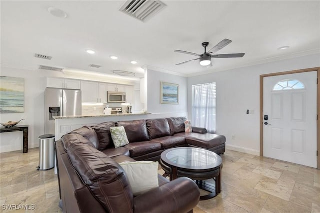 living room with ceiling fan and crown molding