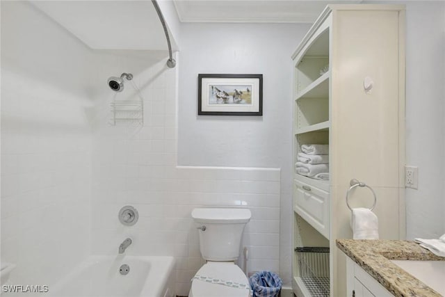 full bathroom with vanity, crown molding, tiled shower / bath combo, toilet, and tile walls