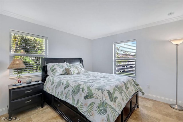 bedroom featuring ornamental molding and multiple windows