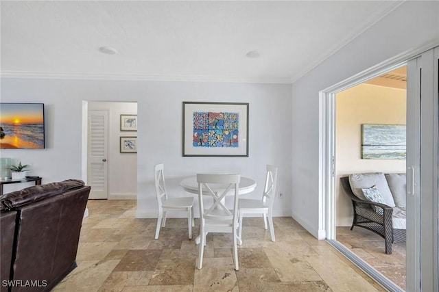 dining area featuring crown molding