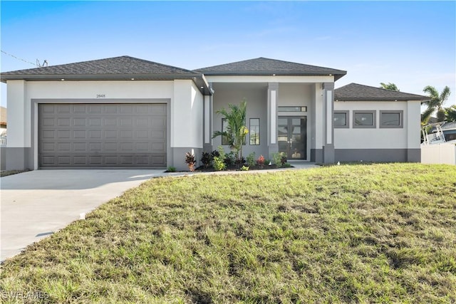 prairie-style house with a garage and a front yard