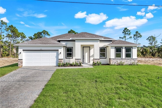 view of front facade featuring a front lawn and a garage