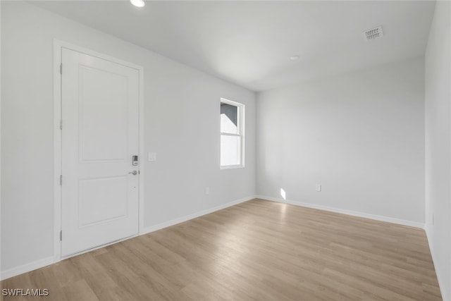 empty room with light wood-type flooring