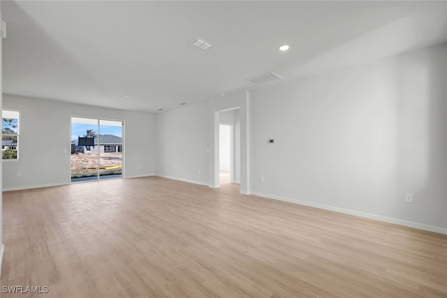 unfurnished room featuring light wood-type flooring